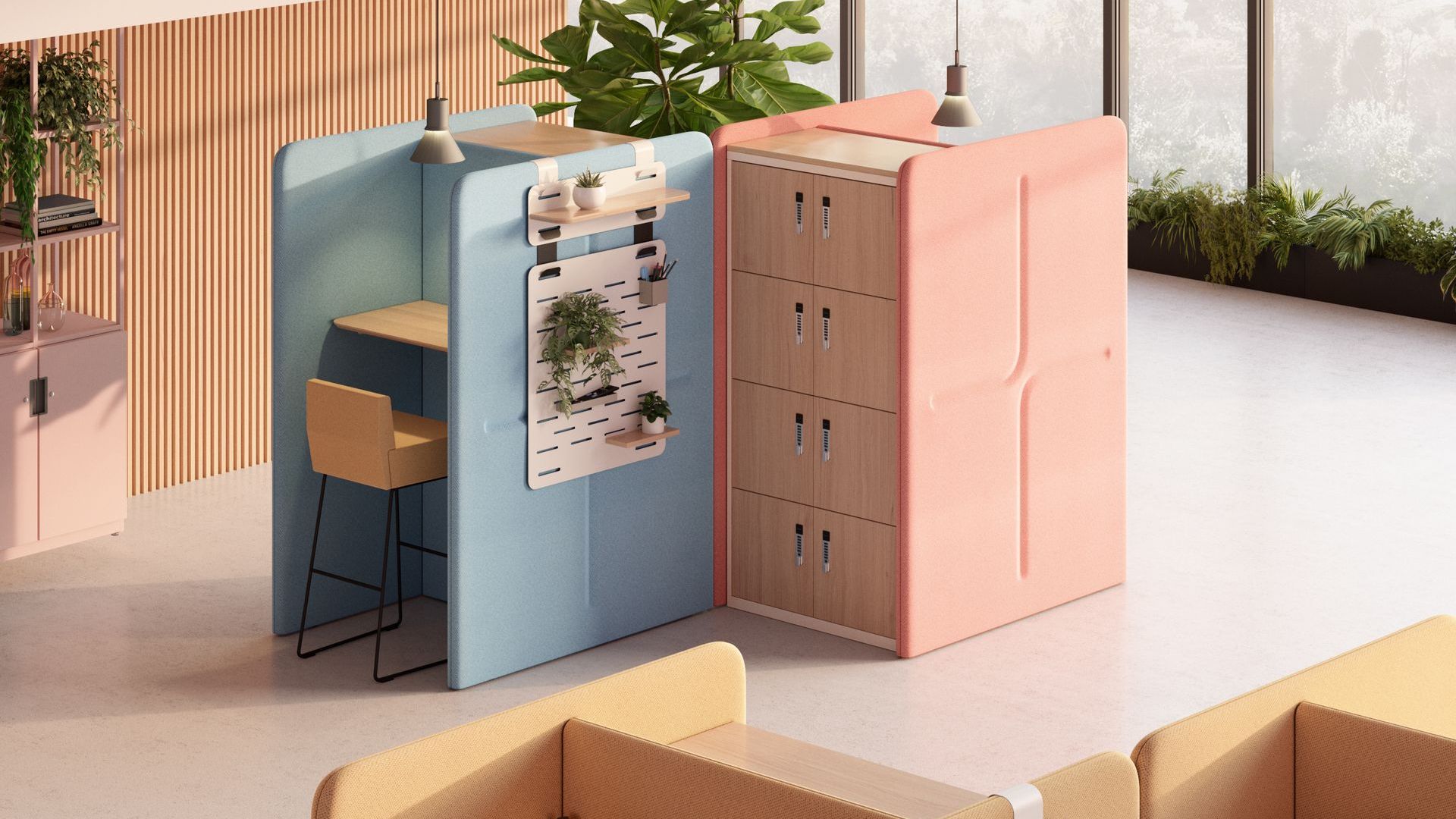 A peach storage unit sits next to a blue booth for private working. At the booth is a stool. The office is spacious and naturally-lit with greenery lining the walls.