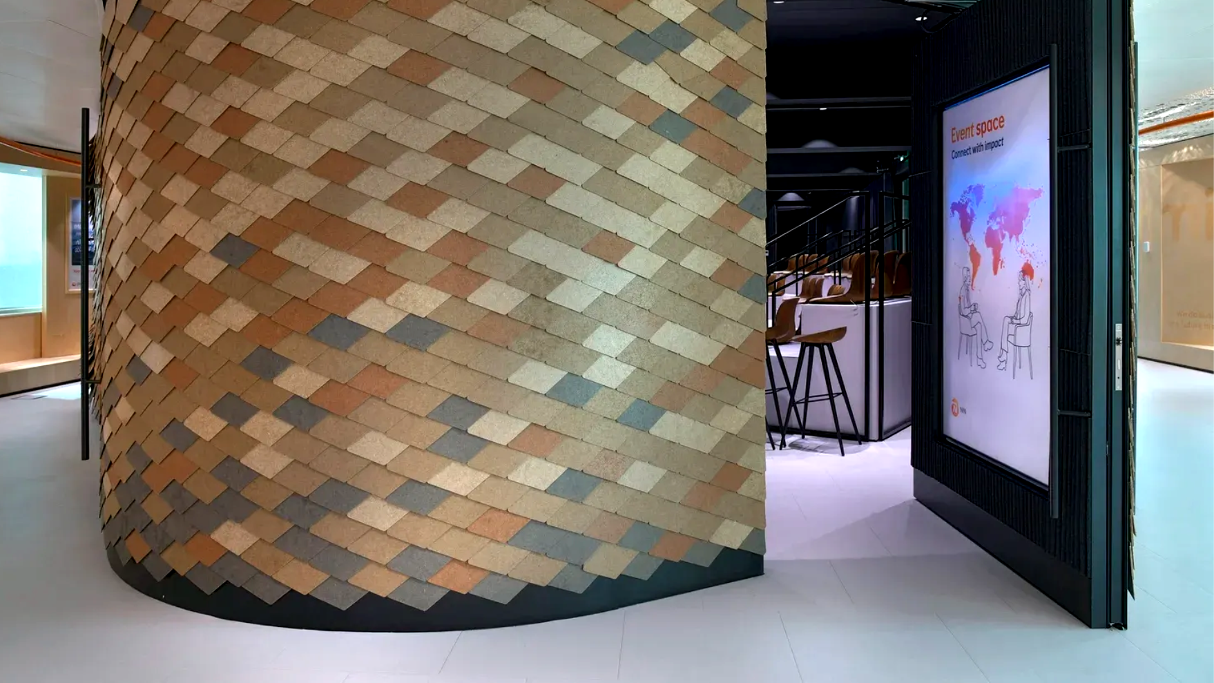 commercial interior design uses recycled veneer panels on an exhibition space