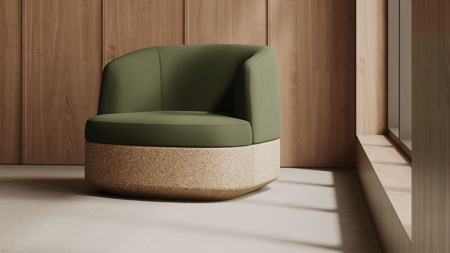 Tejo Lounge chair with cork base and green upholstery in a calming environment which warm natural light coming through the windows