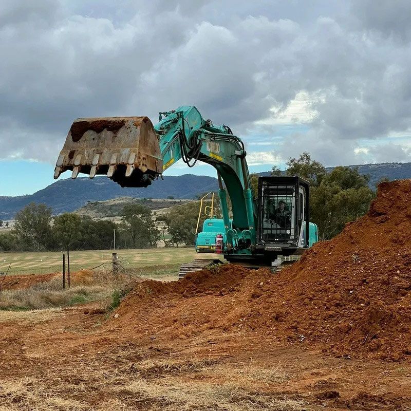 Close Up Details Of Excavator Working On Construction Site — Earthmoving In Upper Manilla, NSW