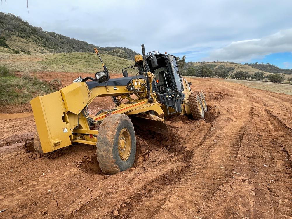 Close Up View Of Yellow Grader — Earthmoving In Upper Manilla, NSW