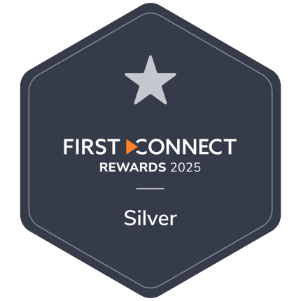 A dark blue hexagon badge with a grey star, featuring the text 