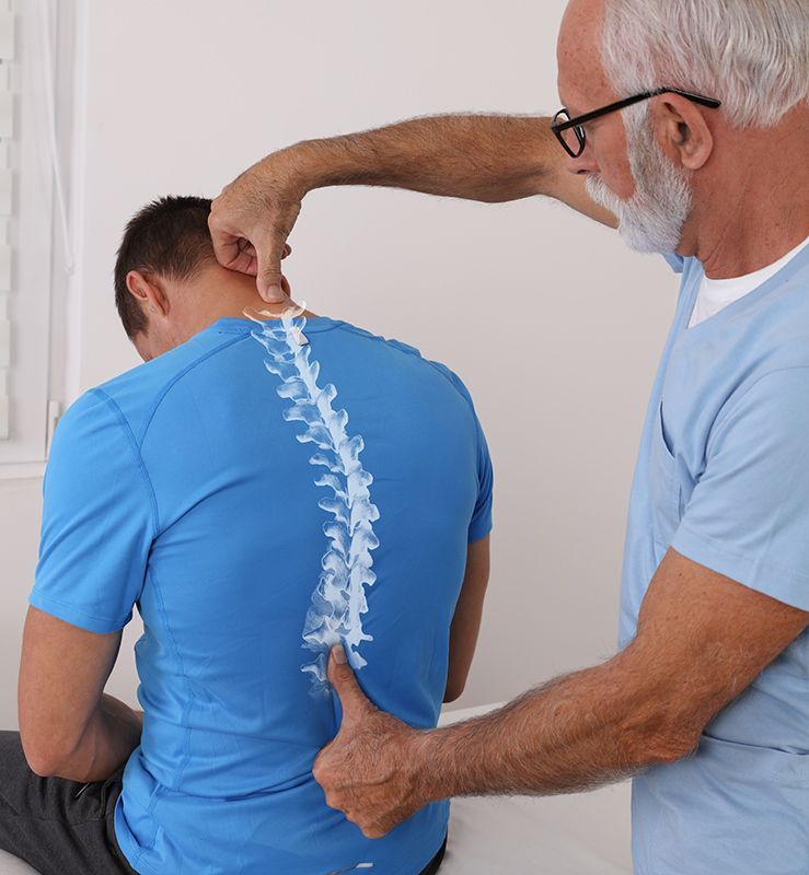 Chiropractor Checking Man's Spine