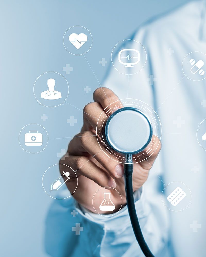 A doctor is holding a stethoscope in his hand.