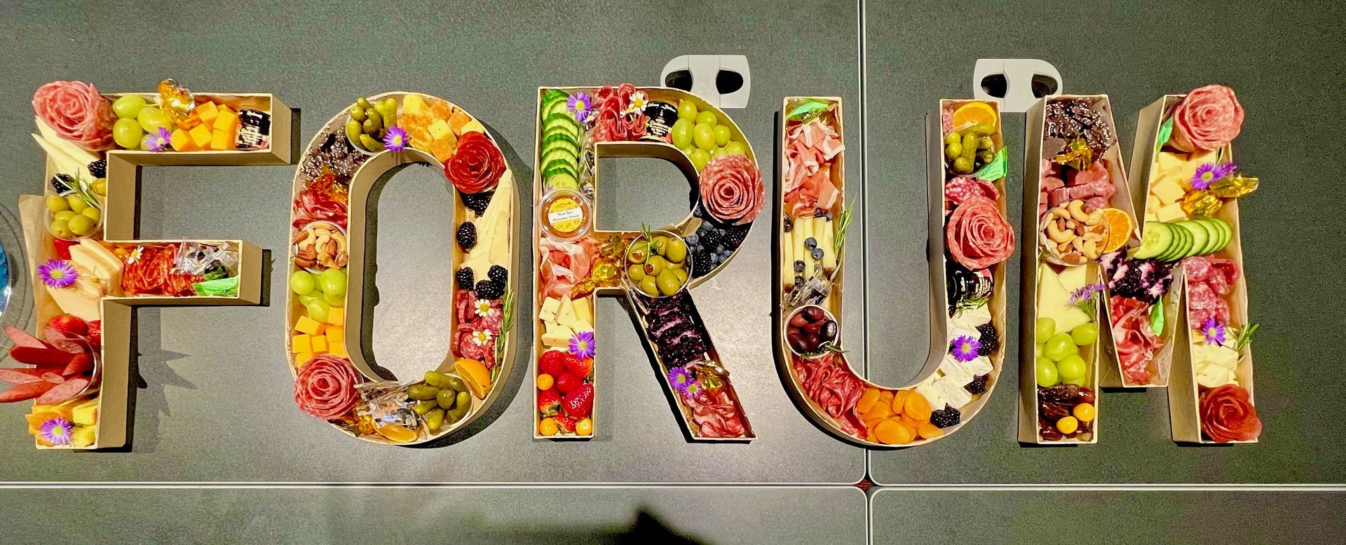 The word forum is made up of fruits and flowers