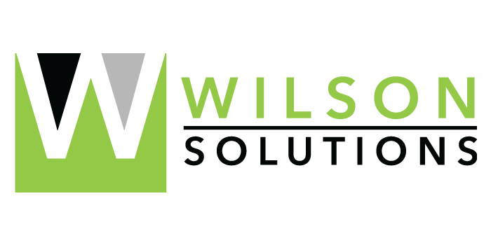The wilson solutions logo is green and white with a black triangle in the middle.