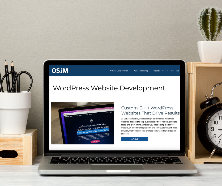 A laptop computer is open to a page about wordpress website development.