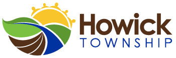 The logo for howick township shows a river , sun and leaves.
