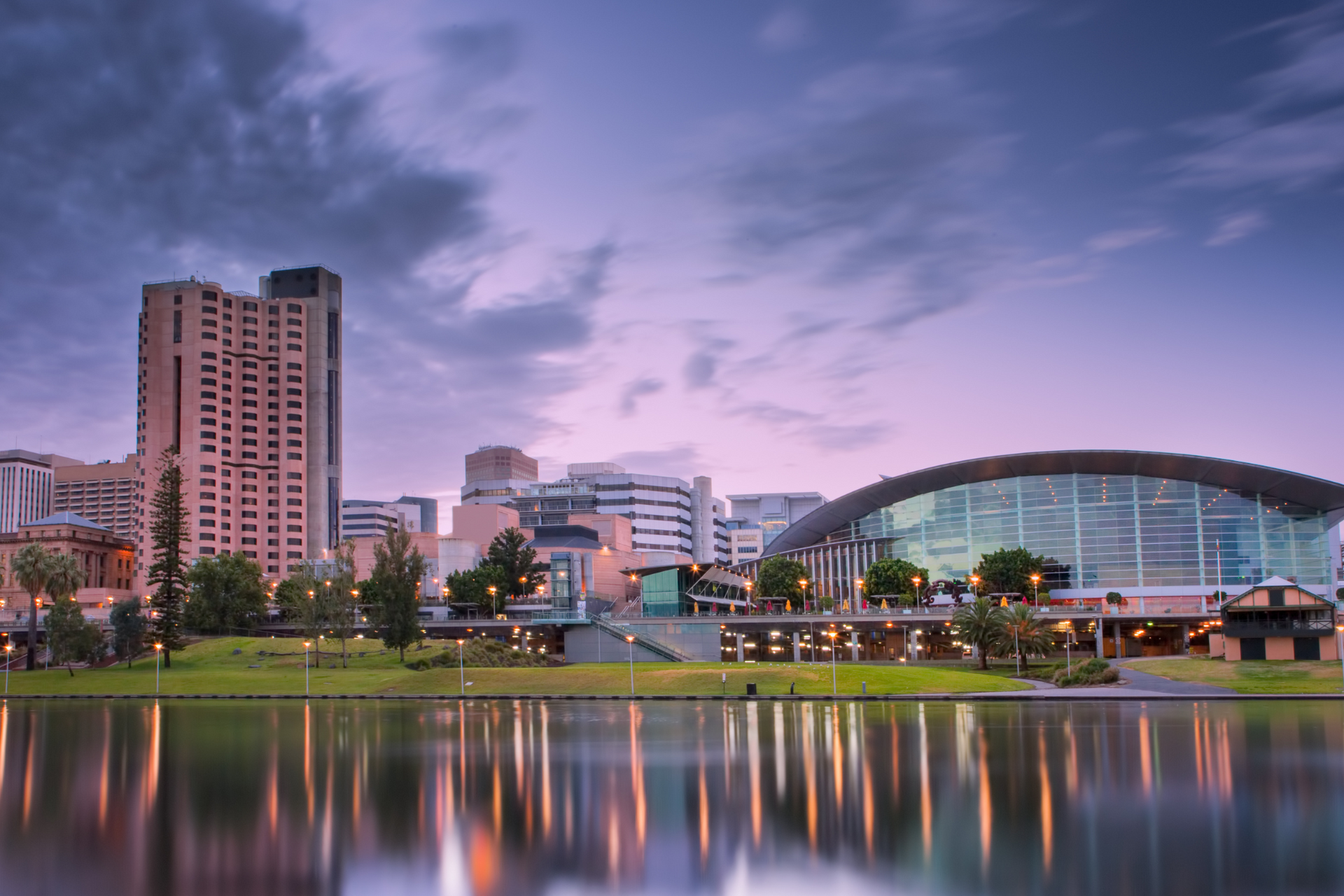 A city skyline with a large body of water in the foreground.