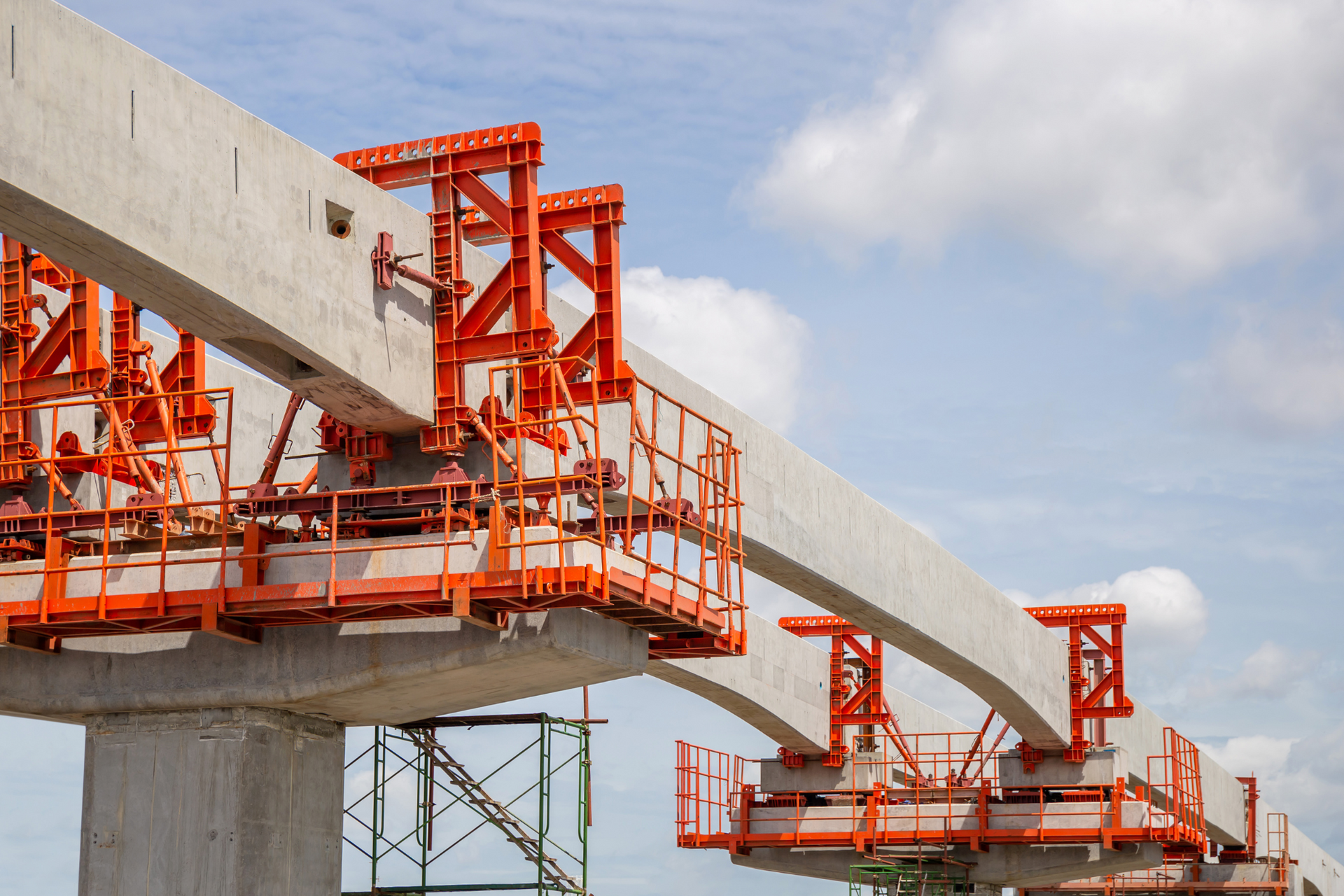 A bridge under construction with a blue sky in the background.