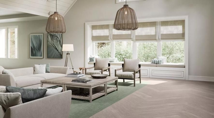 a living room with a couch , chairs , and a coffee table