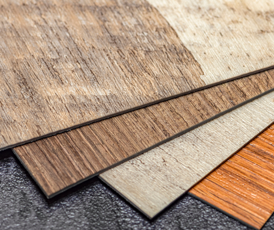 different types of luxury vinyl plank flooring are stacked on top of each other on a table