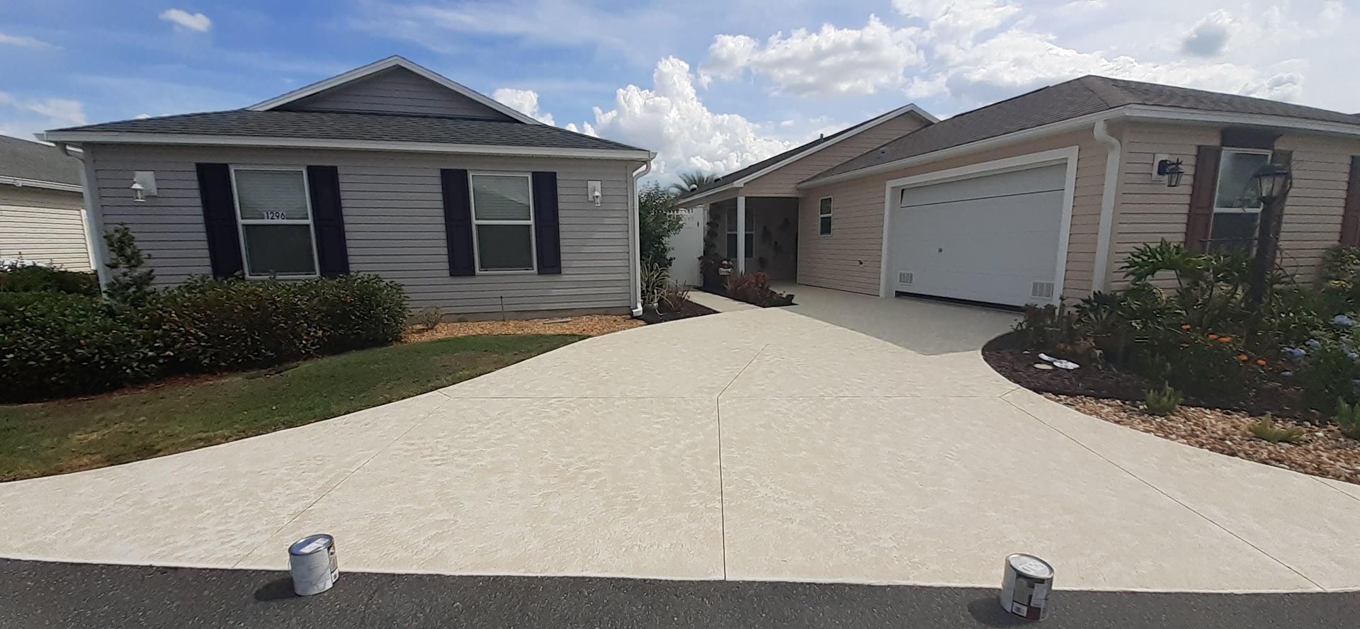 A house with a driveway leading to it and a garage.