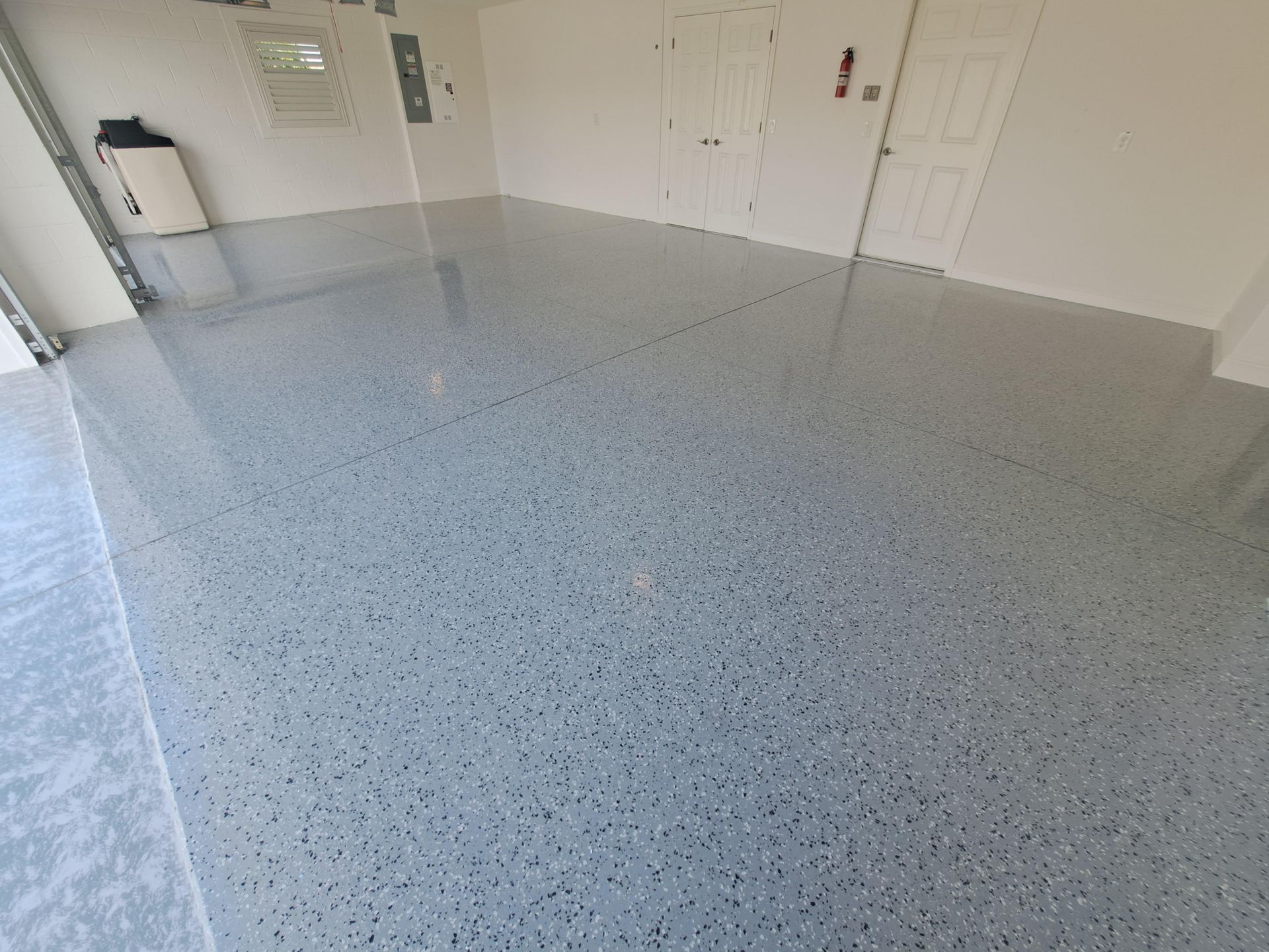 A large room with a gray floor and white walls.