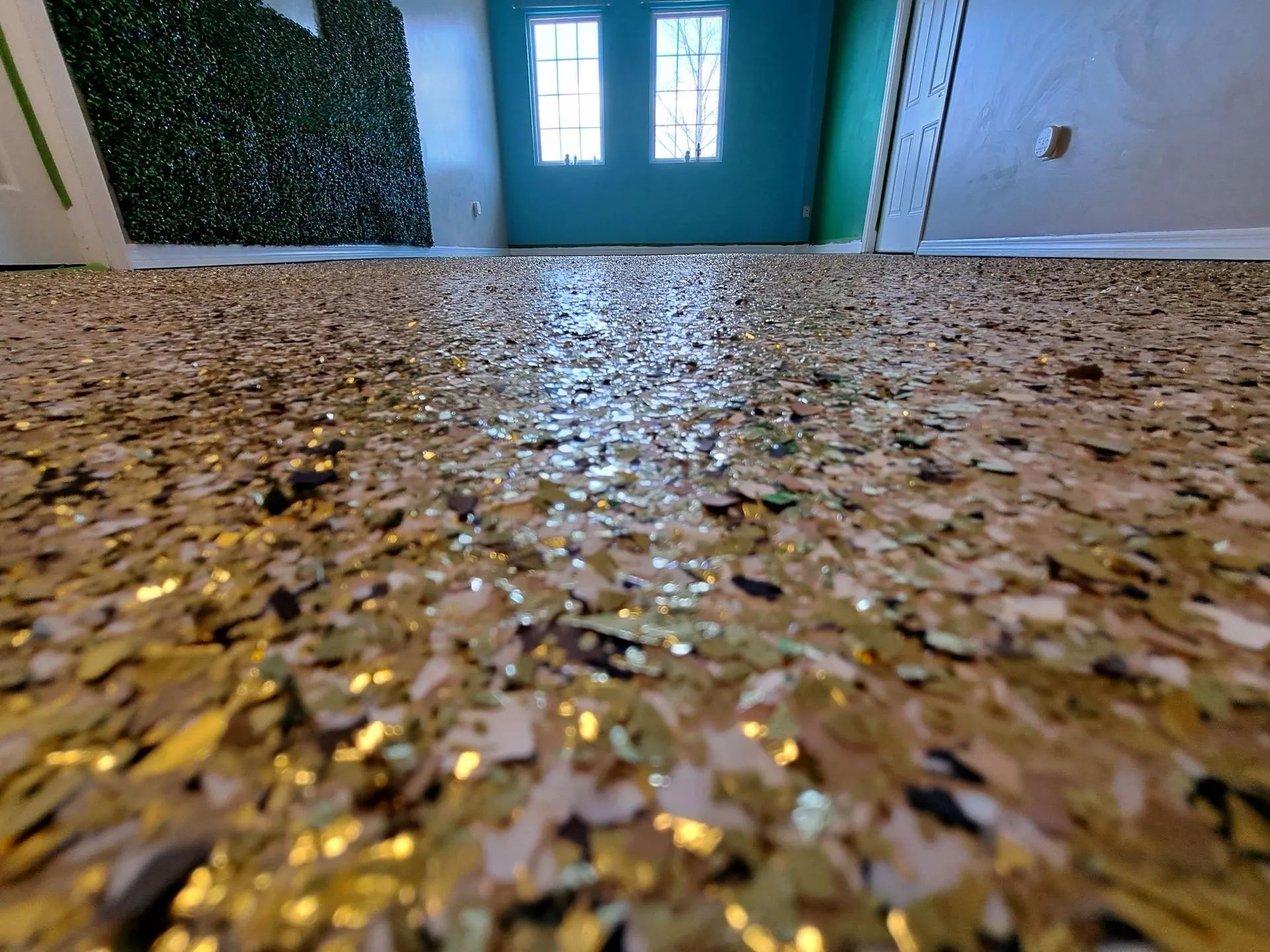 A room with a lot of gold confetti on the floor.