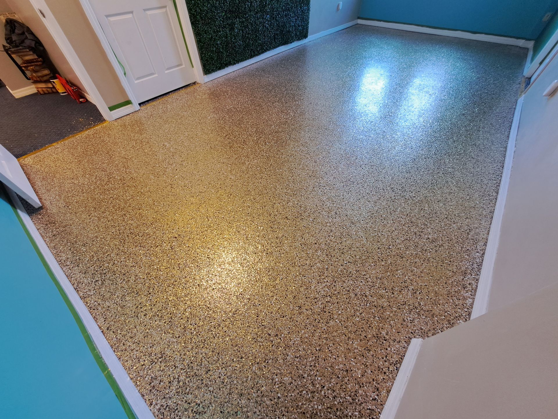 A room with a shiny floor and blue walls.