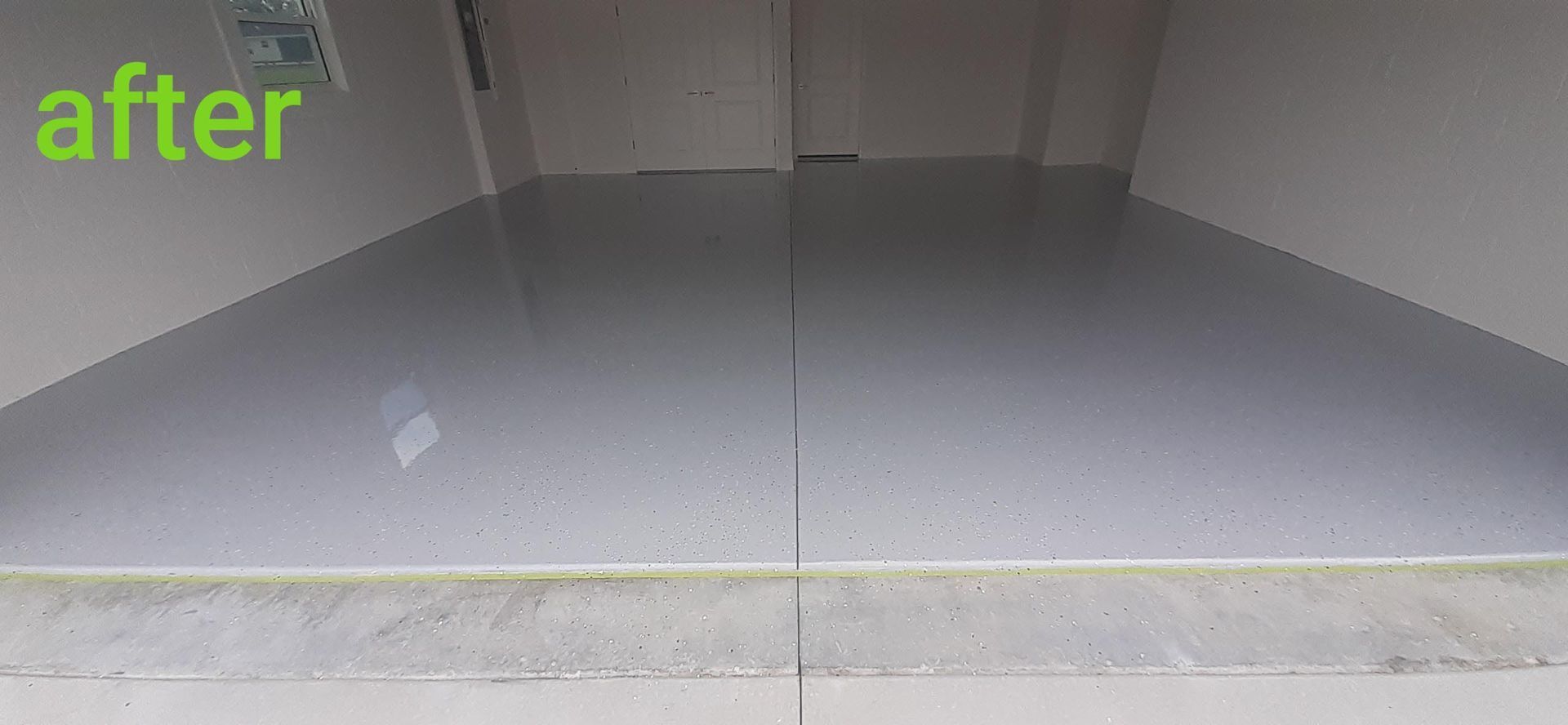 A picture of a garage floor after being painted.