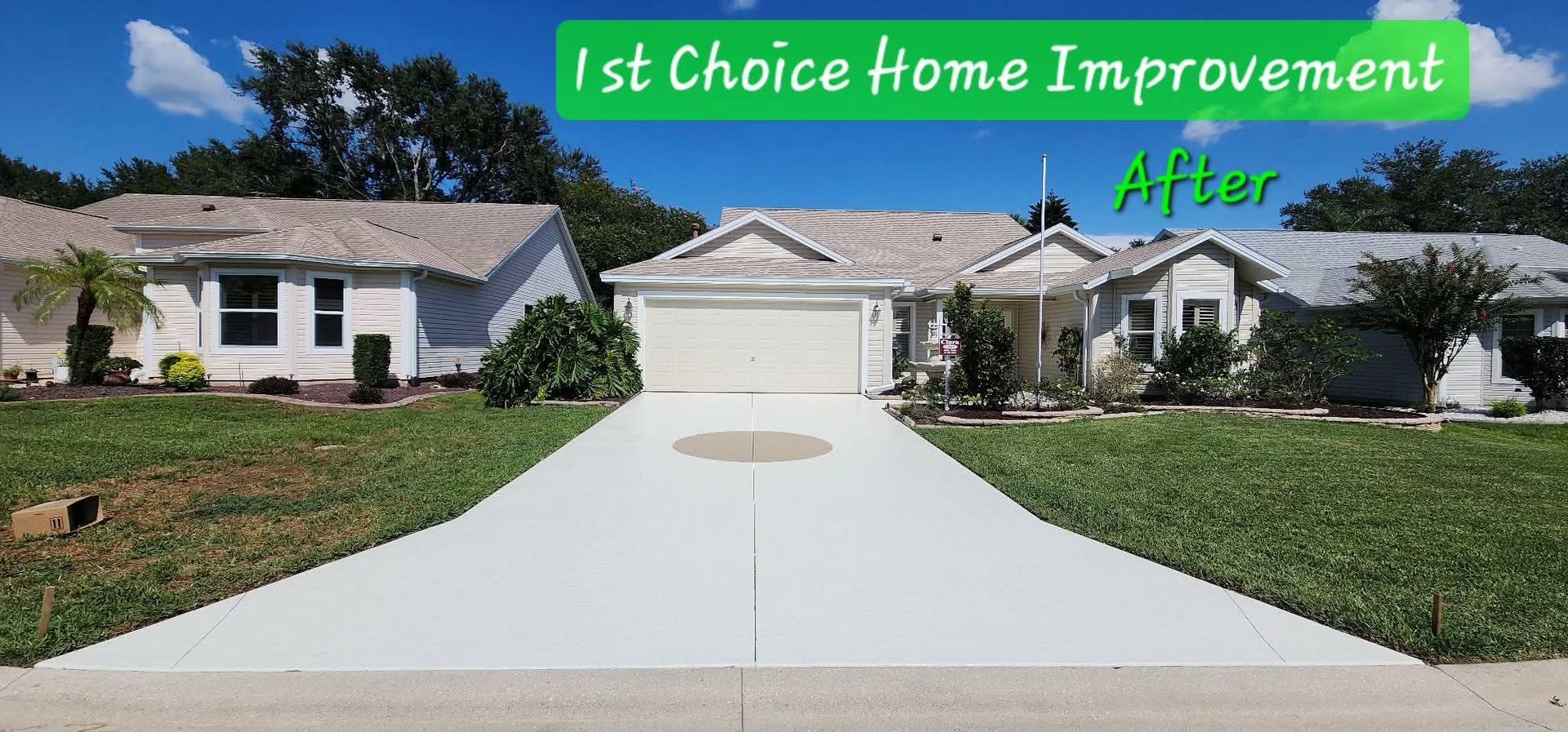 A house with a garage and a driveway in front of it.