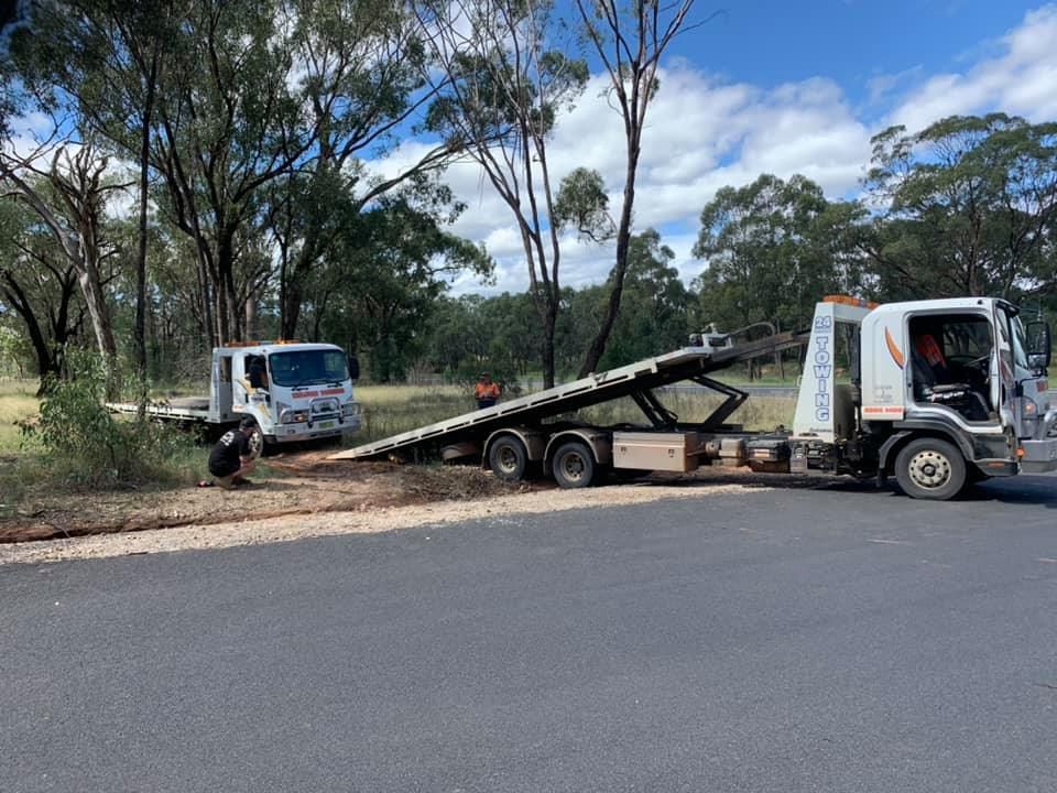 Broken car and tow truck on country road — Tow in Mudgee, NSW