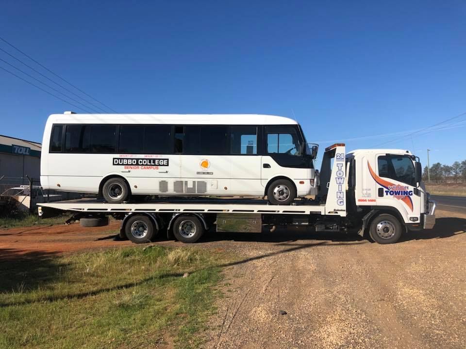 Tow truck with broken car on country road — Tow in Dubbo, NSW