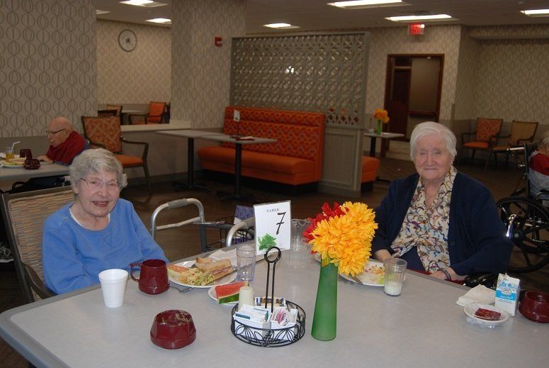 Residents enjoying lunch in the dining room.