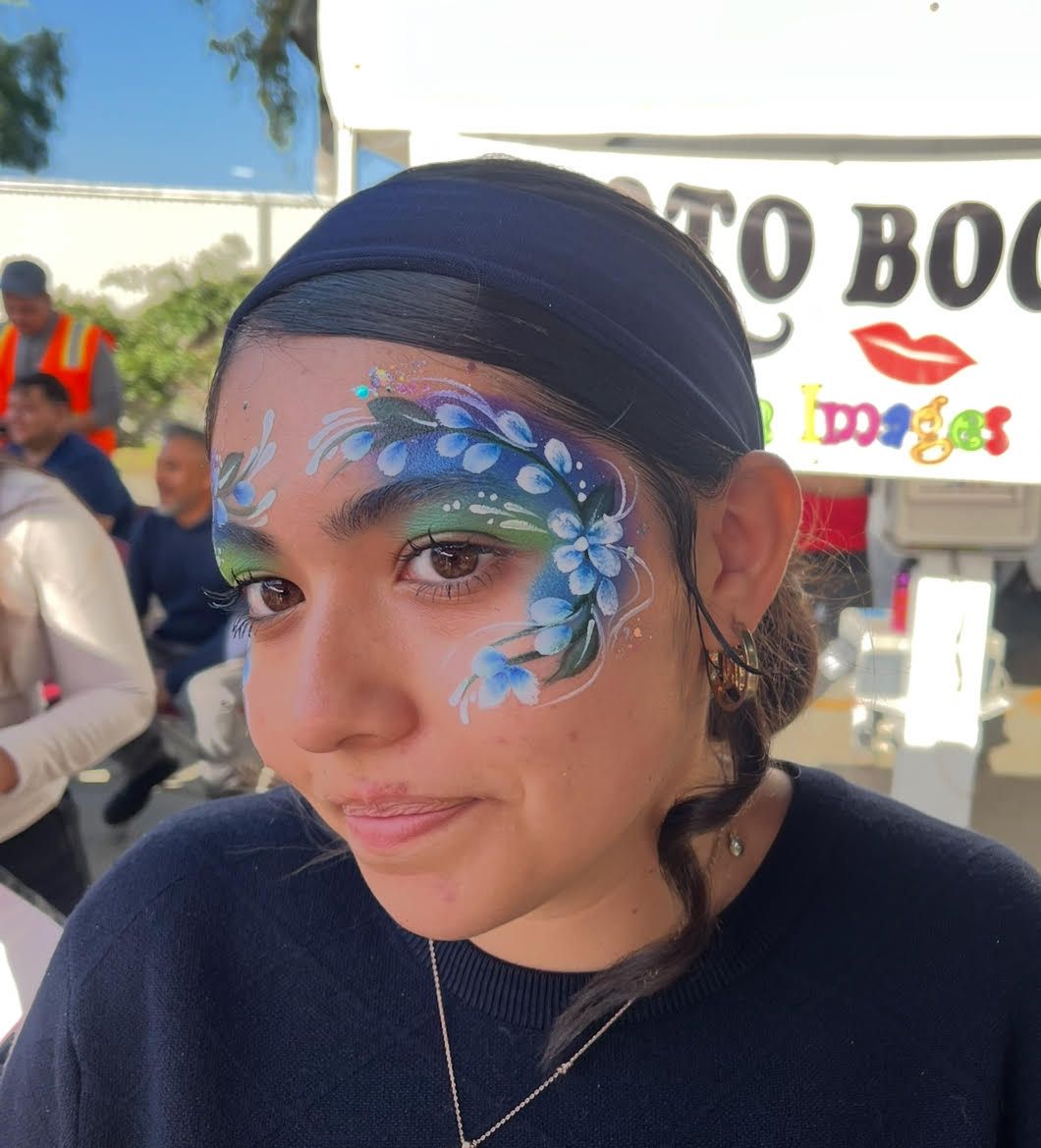 A woman with flowers painted on her face