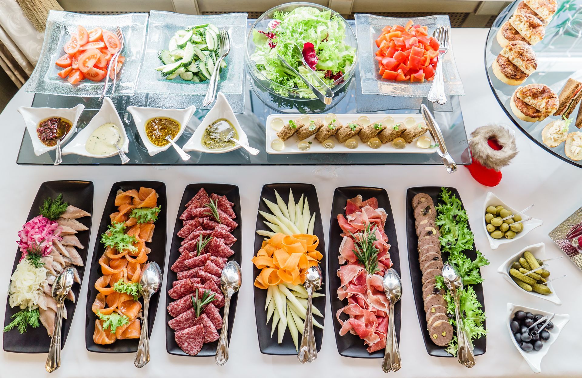 There are many different types of food on the table. EQX Events & City Catering