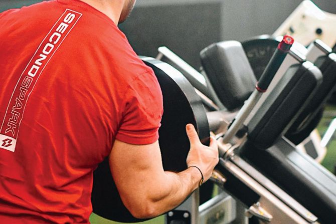 a man wearing a red shirt with the word second on it