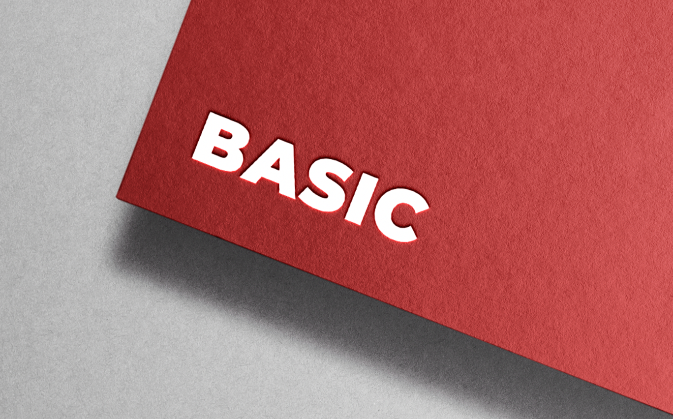 A red piece of paper with the word basic written on it