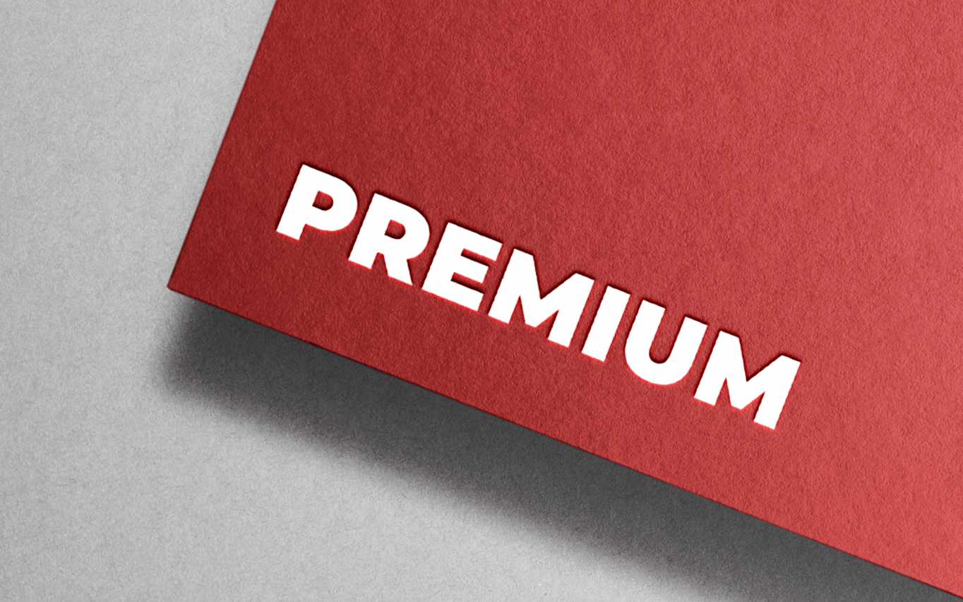 A red piece of paper with the word premium written on it