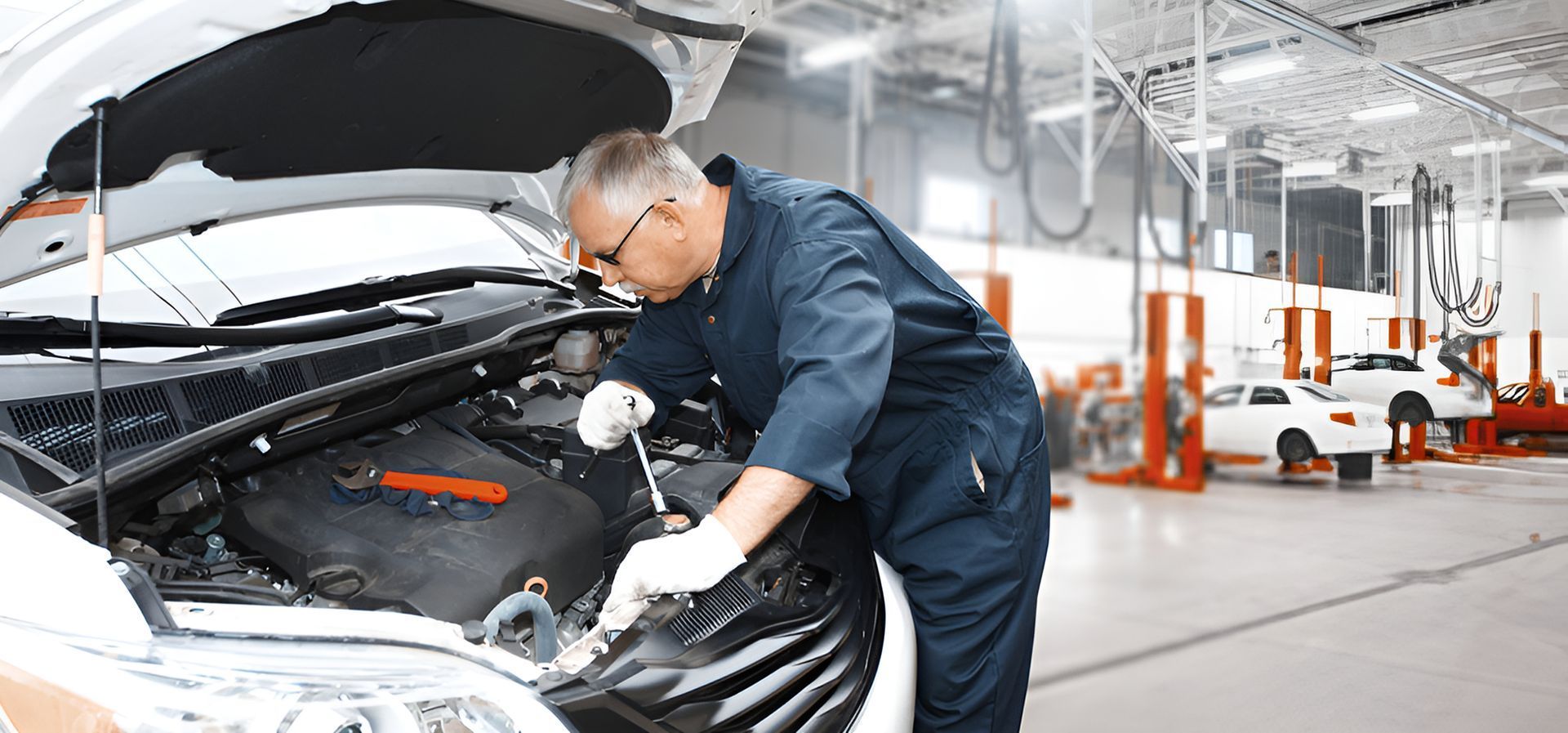 Mechanic Inspecting a Car Engine — Fischer Automotive in Svensson Heights, QLD
