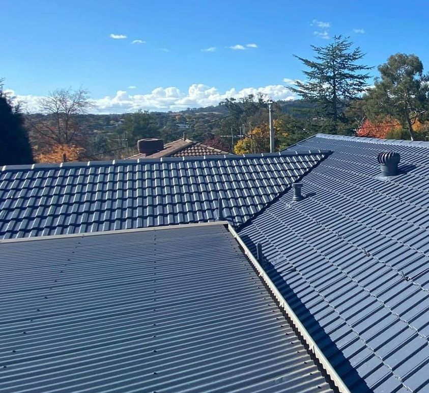 A Close Up of a Roof With a Blue Sky in the Background — RJT Roofing In Bonner, ACT