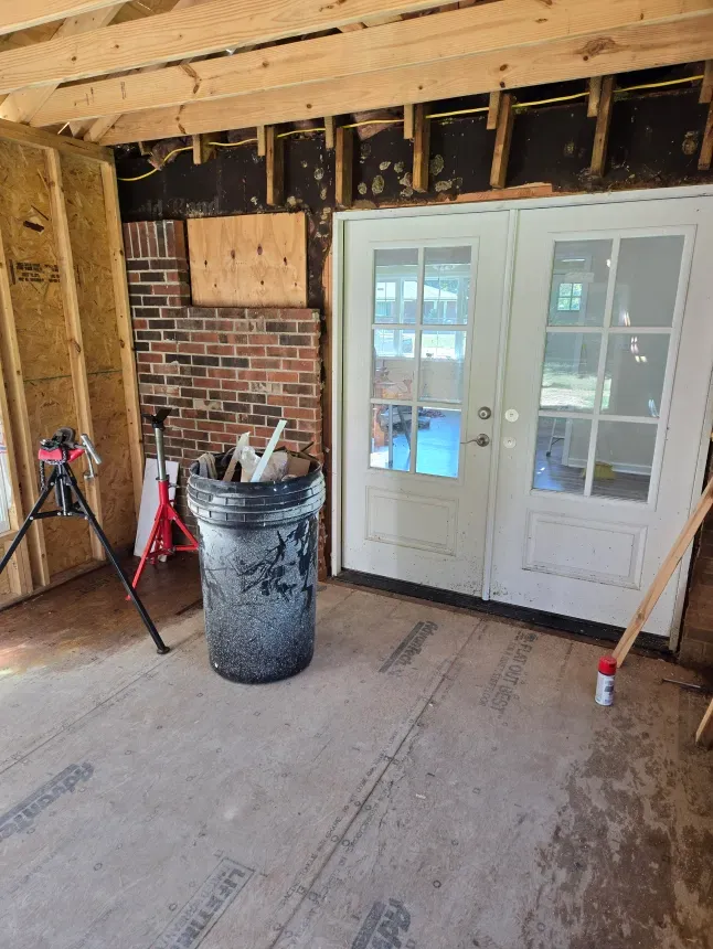 There is a trash can in the middle of the room.