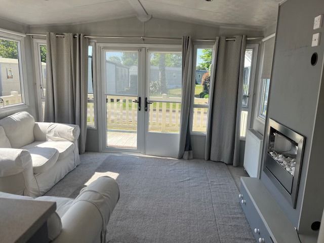 The spacious lounge within a 2 bedroom holiday home for sale at Cotswold Grange Country Park