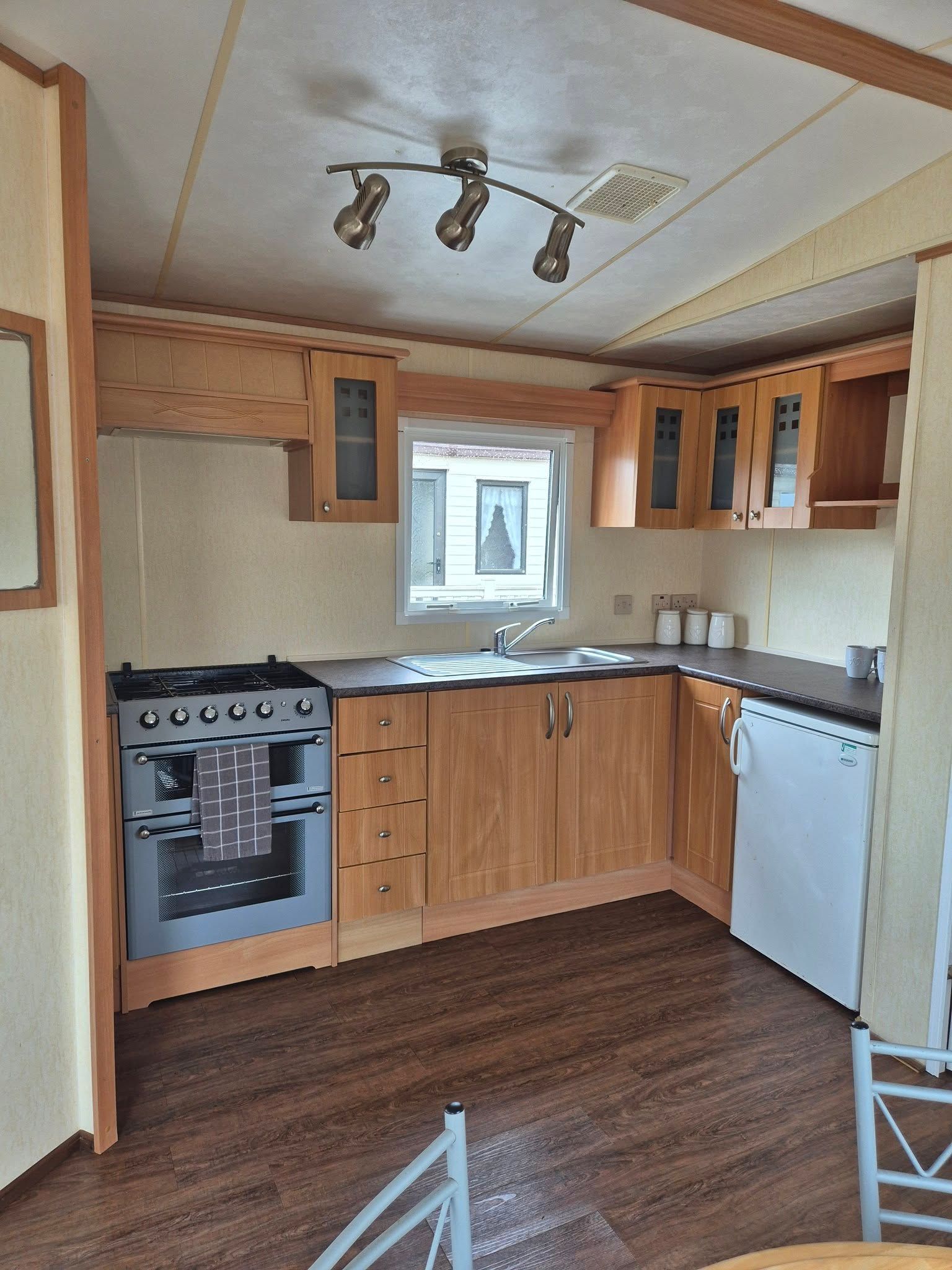 Kitchen area within a 2 bedroom ABI Brisbane  holiday home for sale by Cotswold Grange Country Park