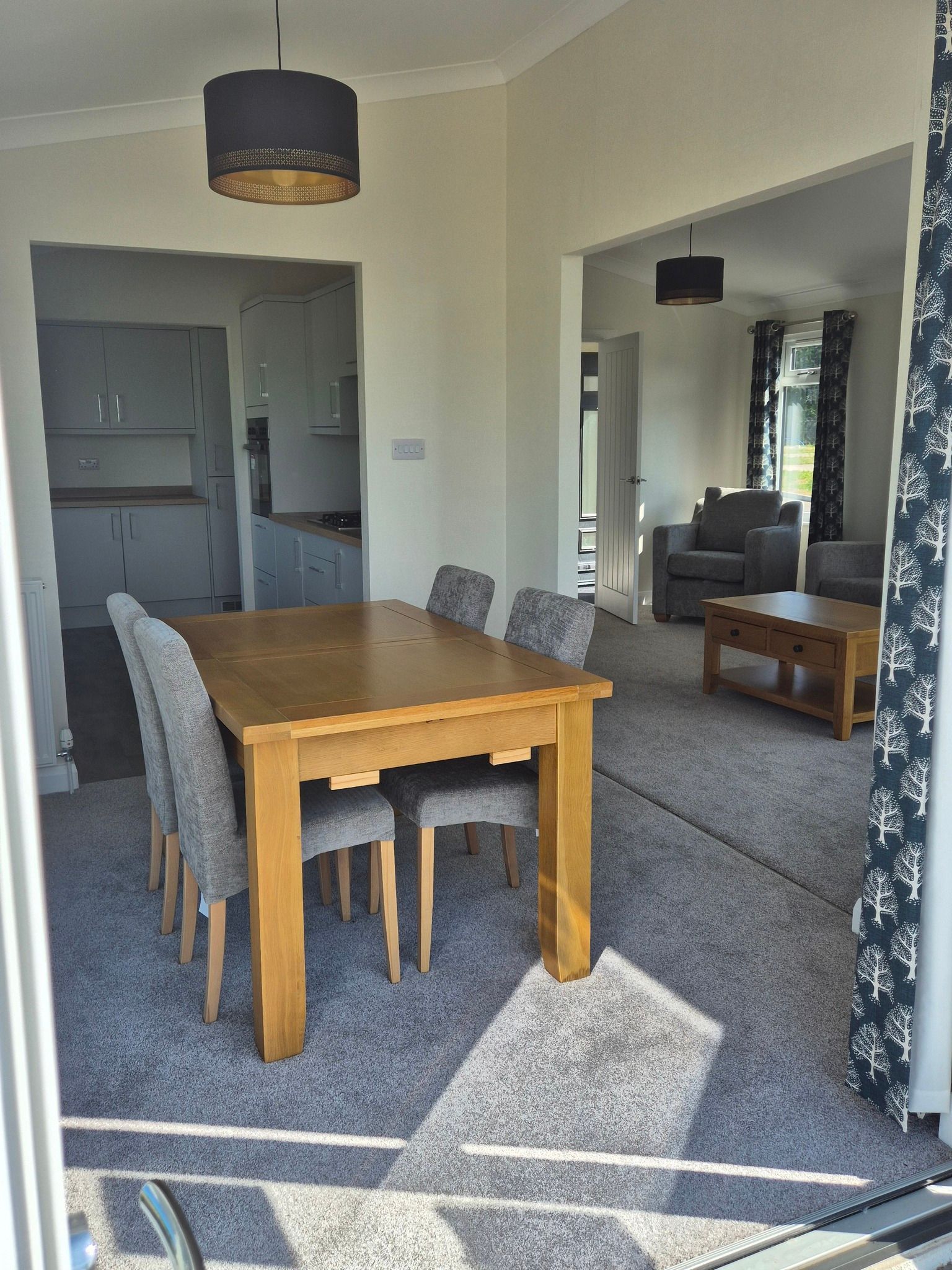 Open plan kitchen, diner and lounge area within the beautiful Lodge for sale at Cotswold Grange Country Park