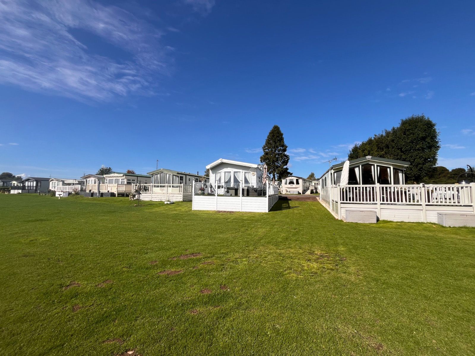 A row of mobile homes sitting on the grounds of Cotswold Grange Country Park in Twyning Gloucestershire