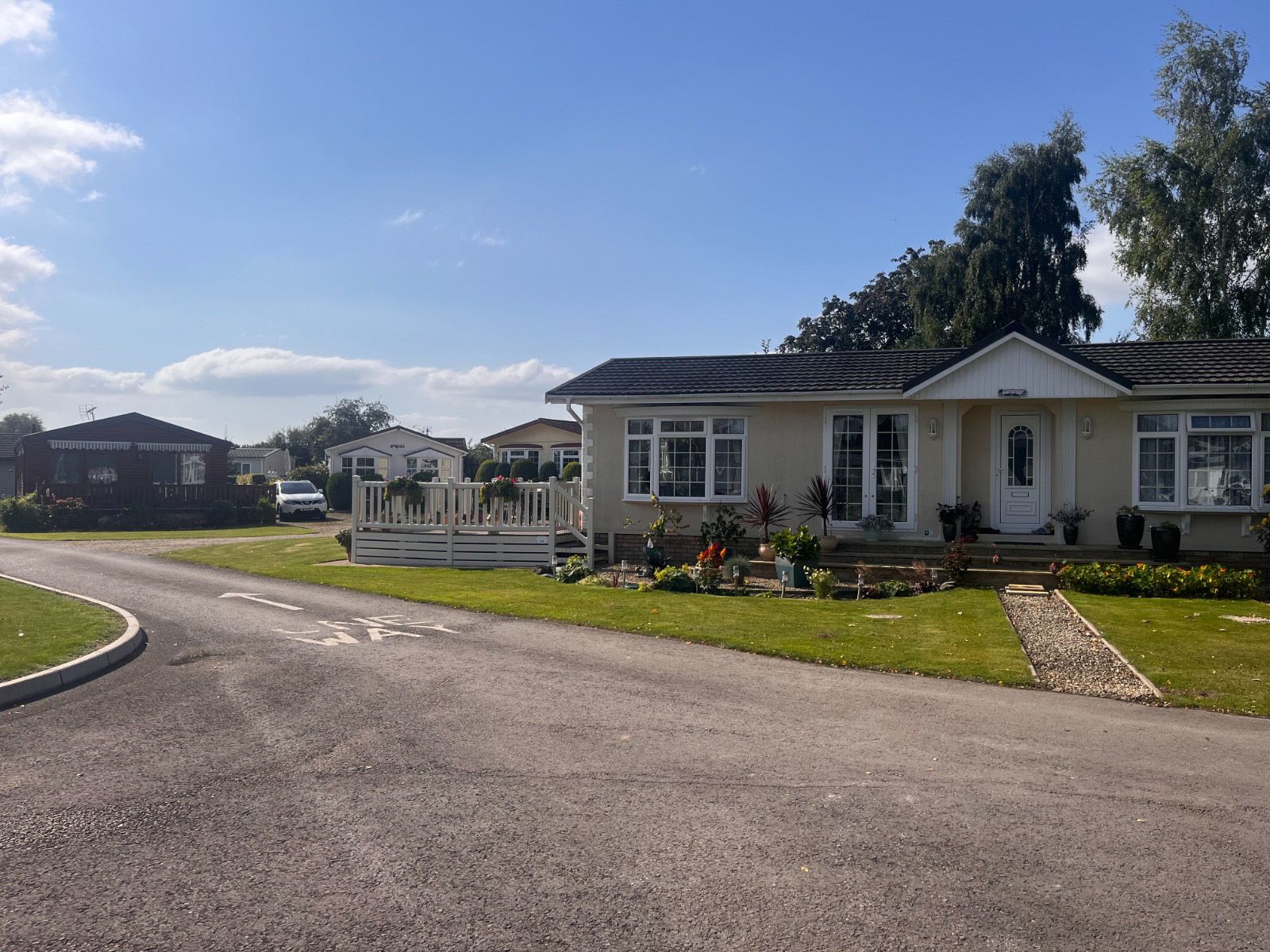 A house is sitting on the side of a road in a residential area.