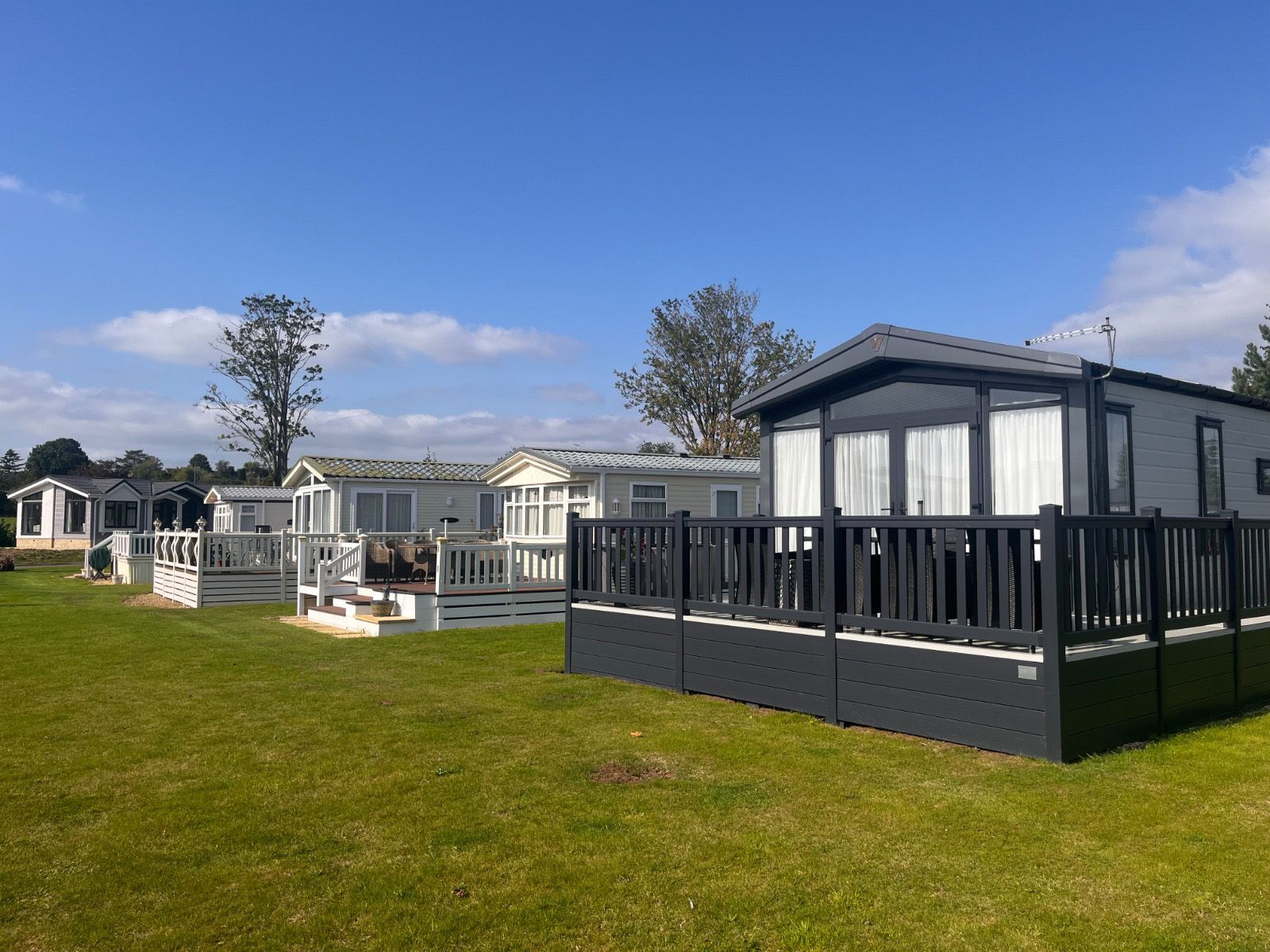 A row of mobile homes at Cotswold Grange Coutry Park