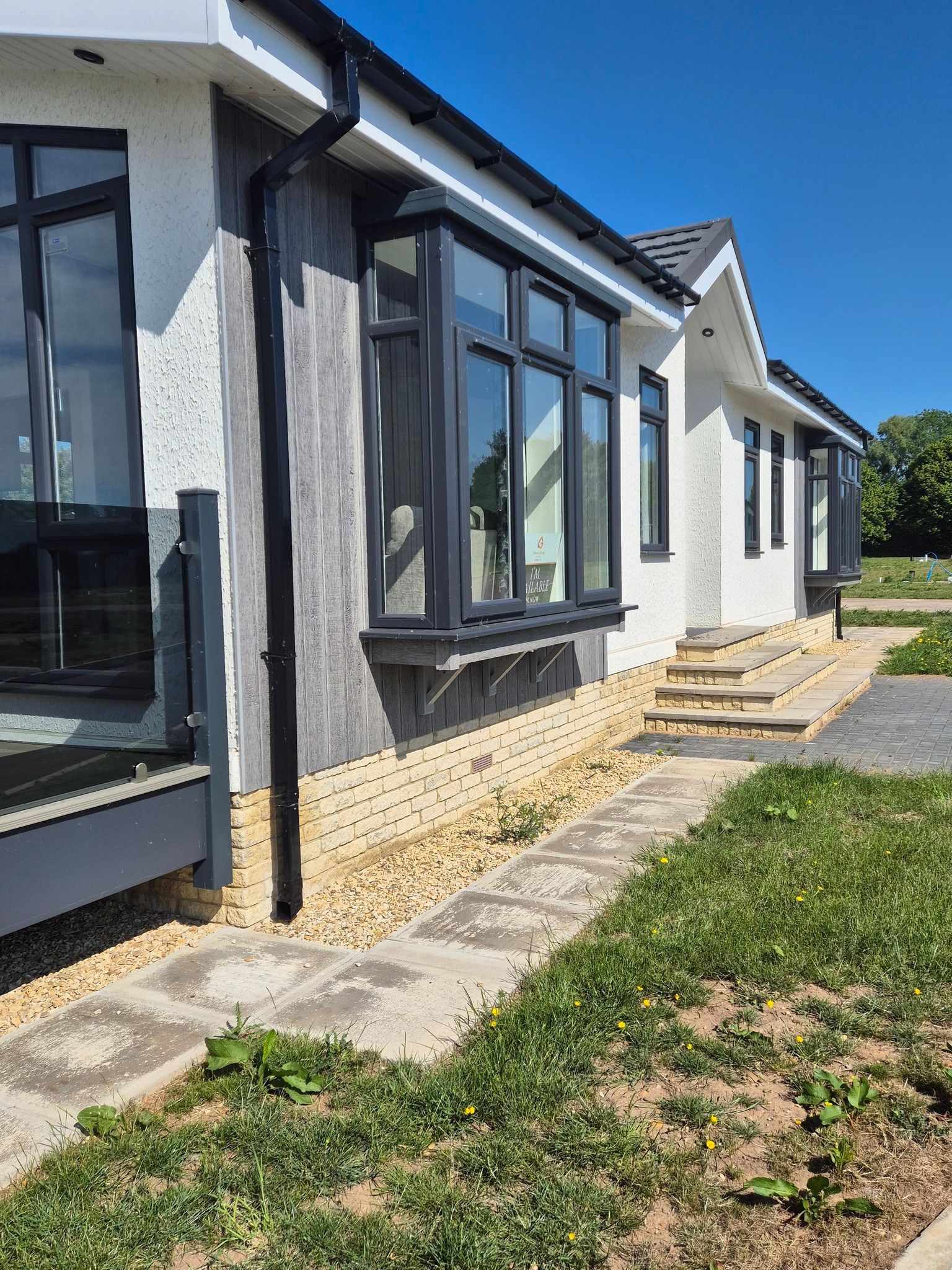 Side view of the Charnwood Park Home for sale at Cotswold Grange Country Park