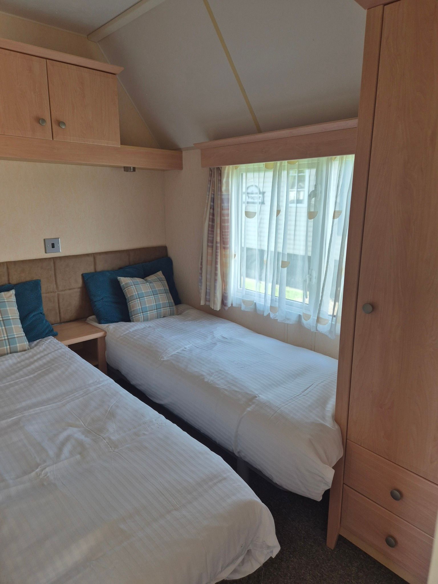 Bedroom with 2 single beds within a 2 bedroom Concept holiday home for sale by Cotswold Grange Country Park