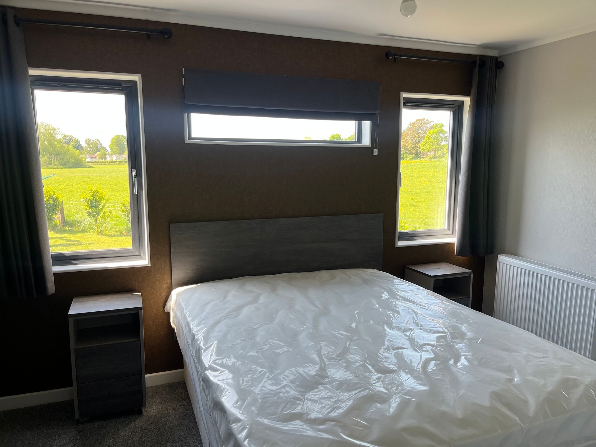 Double bedroom within the Tingdene Park Home for sale at Cotswold Grange Country Park
