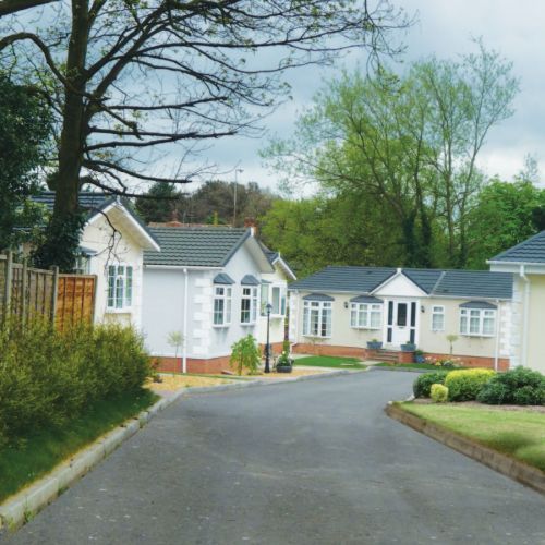 A row of white houses on a residential street