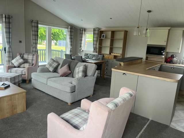 Spacious lounge within the beautiful Portland Lodge for sale at Cotswold Grange Country Park