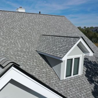 an aerial view of a roof with a window on it