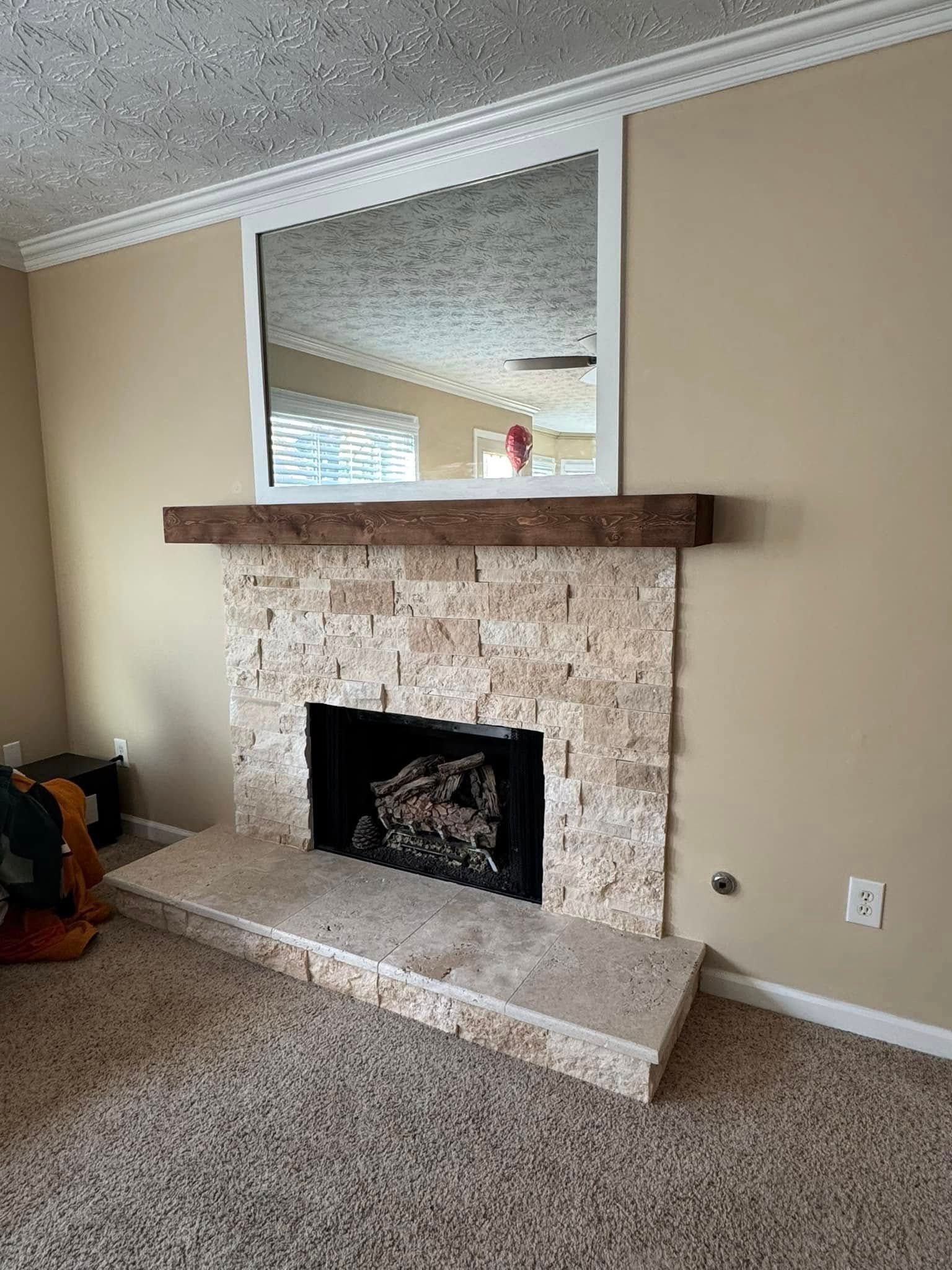 A fireplace and a flat screen tv.