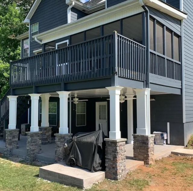 A kitchen with a large wooden table and chairs.