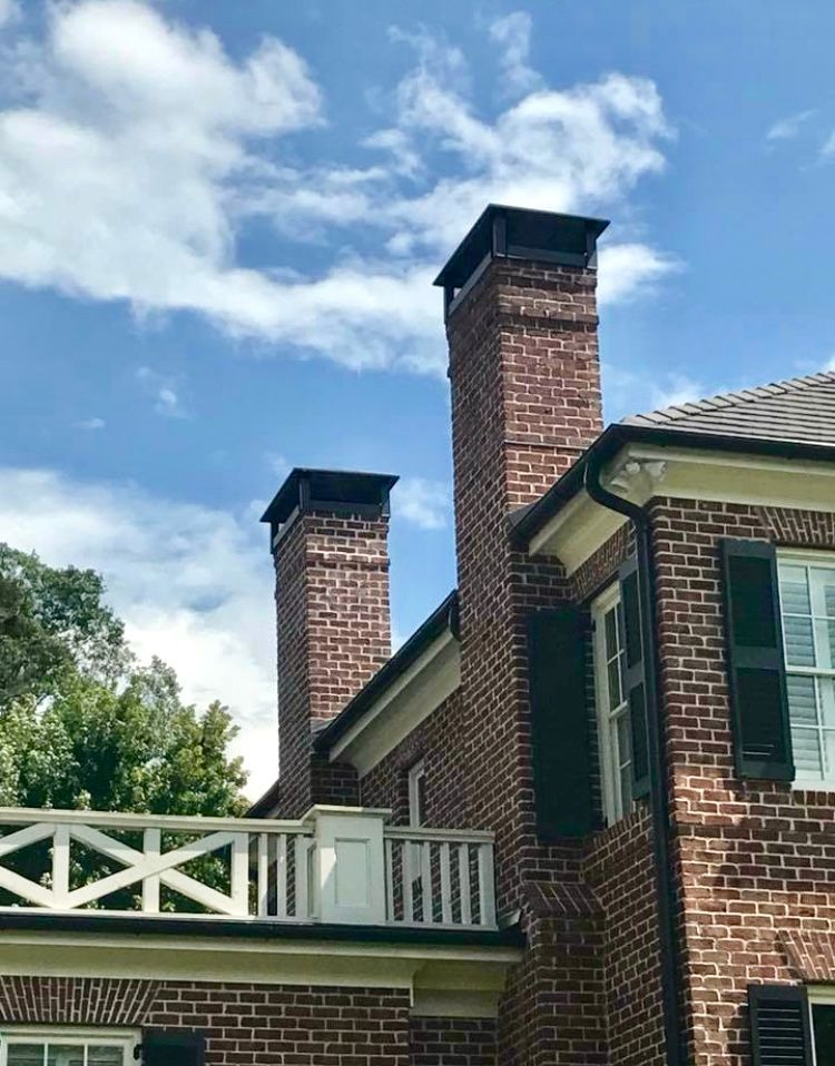 A bathroom with two sinks and a walk in shower.