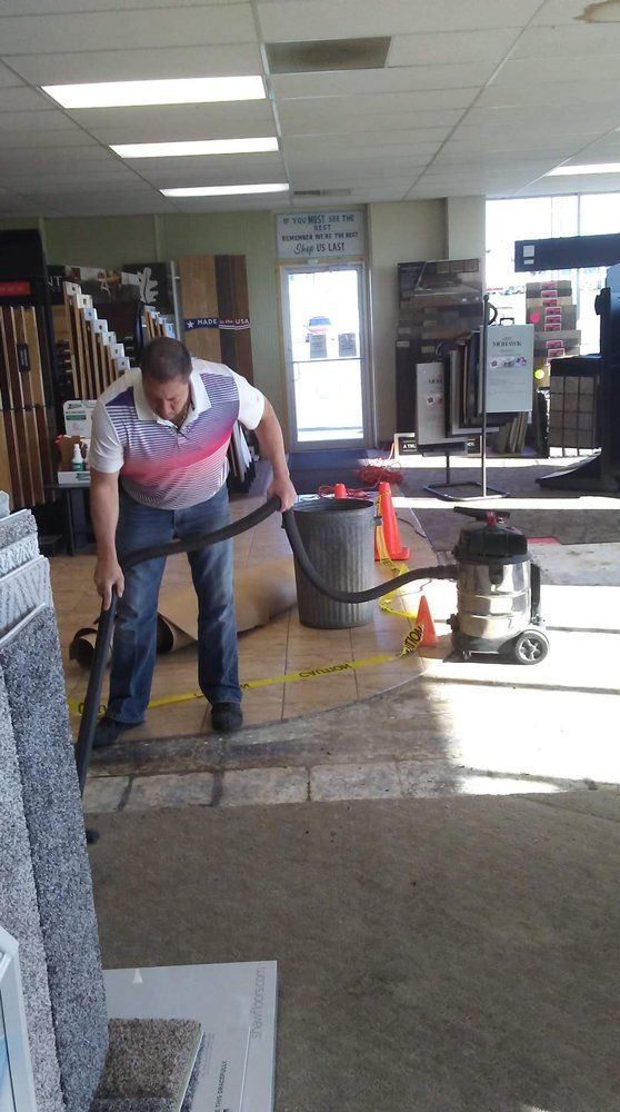 Man Using Vacuum On Carpet — Mount Vernon, IL — Southern Illinois Tile & Carpet