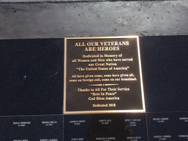 A plaque that says all our veterans are heroes